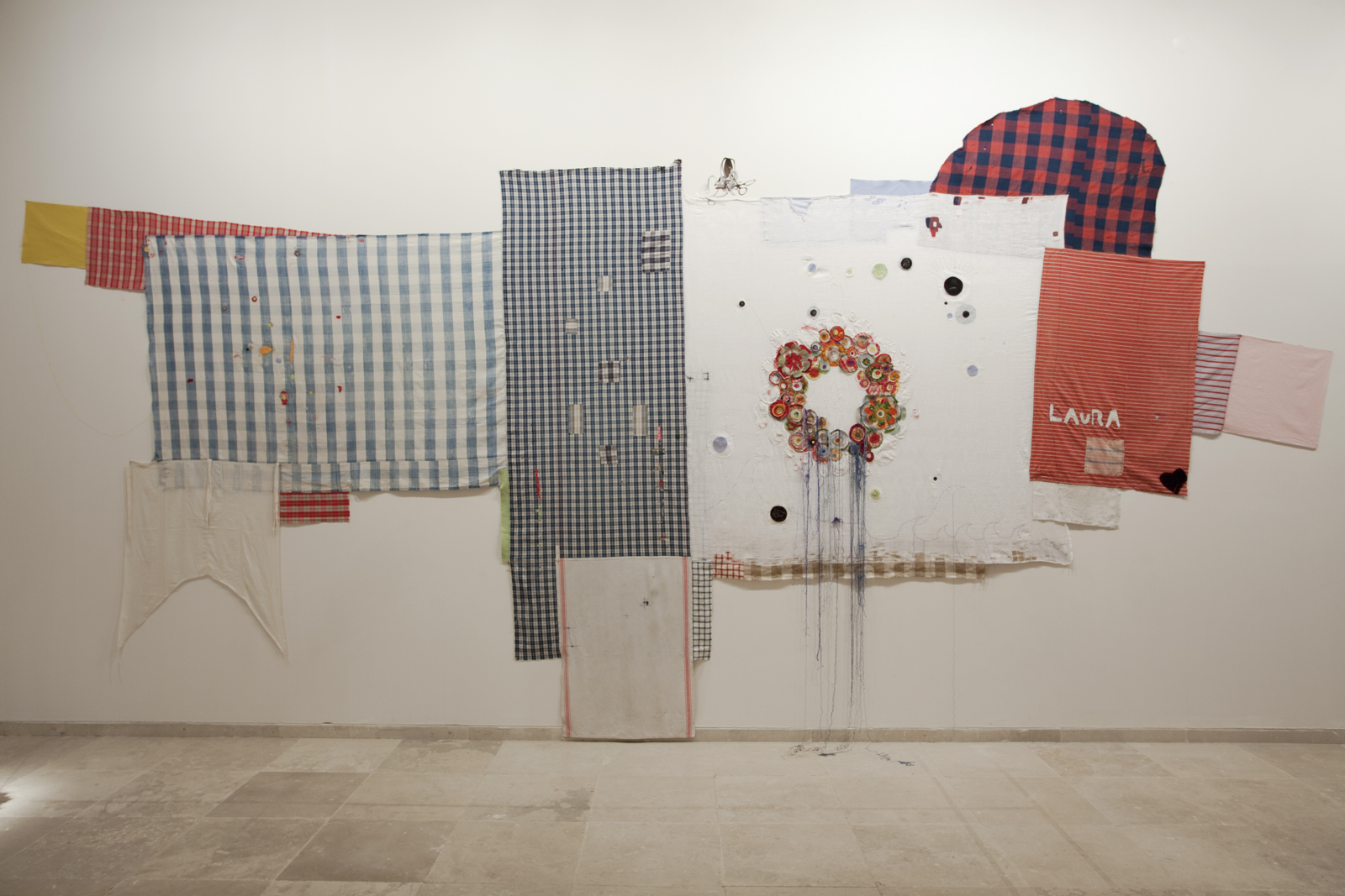 <p>Laura at the dinner table (2013), darned/embroidered family linens and drawing journal, 300cm x 500cm</p>
