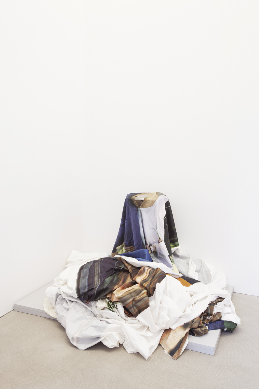 <p>D/Innertime (2012) after the performance, printed cotton, stool, and iron rod</p>
