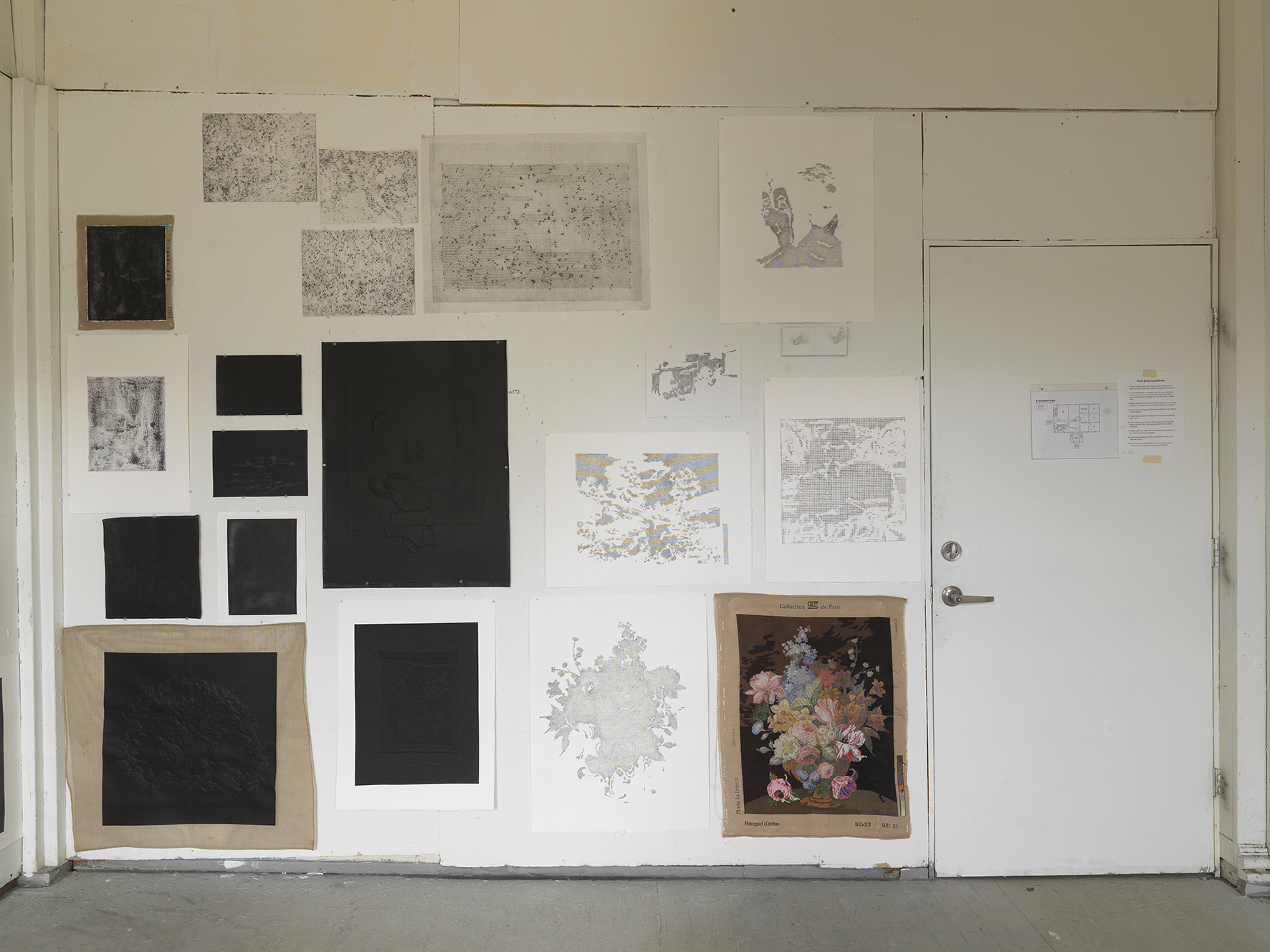 <p>Studio process wall showing experimental needlepoint and print work</p>
