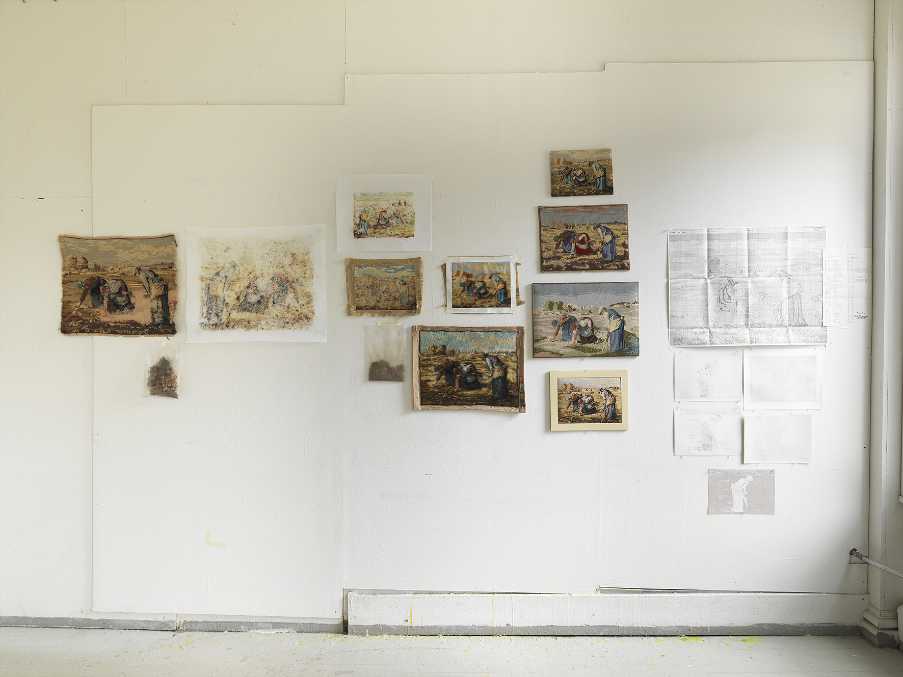 <p>Studio wall showing cluster of experimental research pieces</p>
